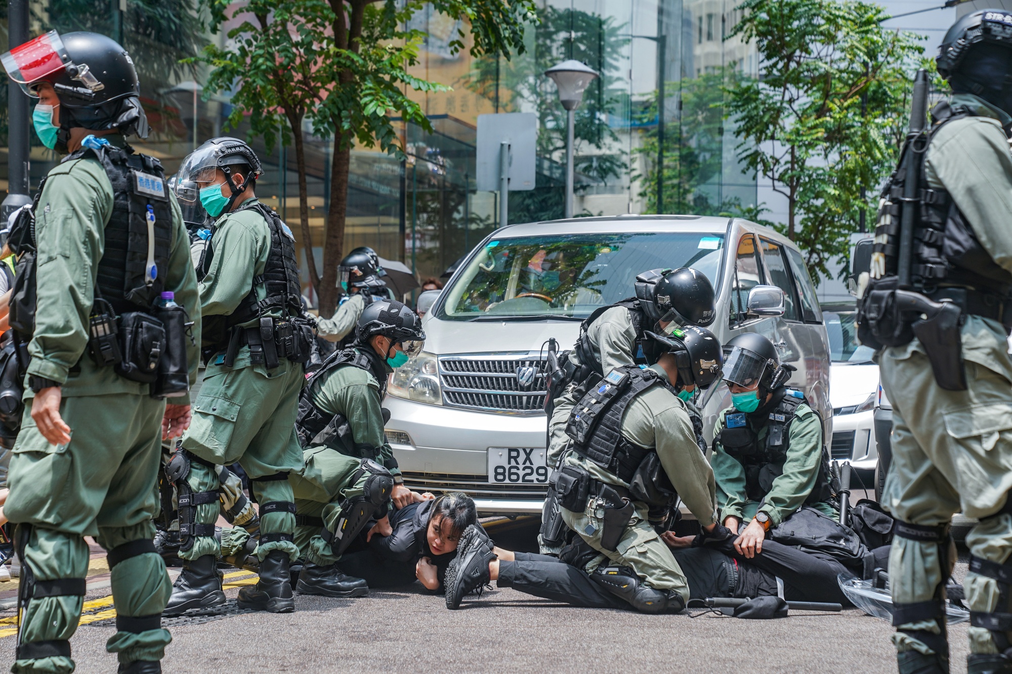 Riot police arrest demonstrators during a protest on May 27.