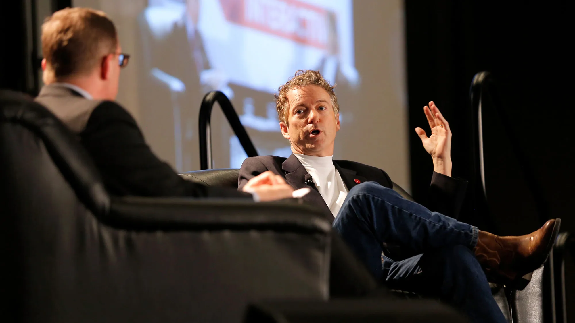 Journalist Evan Smith (L) and U.S. Senator Rand Paul speak onstage at 'A Conversation With Senator Rand Paul' during the 2015 SXSW Music, Film + Interactive Festival at JW Marriott on March 15, 2015 in Austin, Texas.
