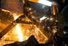 Sparks form as molten iron is poured into a bucket at Trumbull Metal Specialties in Niles, Ohio, U.S., on Friday, April 3, 2015. Manufacturing in the U.S. expanded in March at the slowest pace in almost two years, restrained by the perfect storm of a stronger dollar, a plunge in oil prices and lingering delays in shipments from West Coast ports.