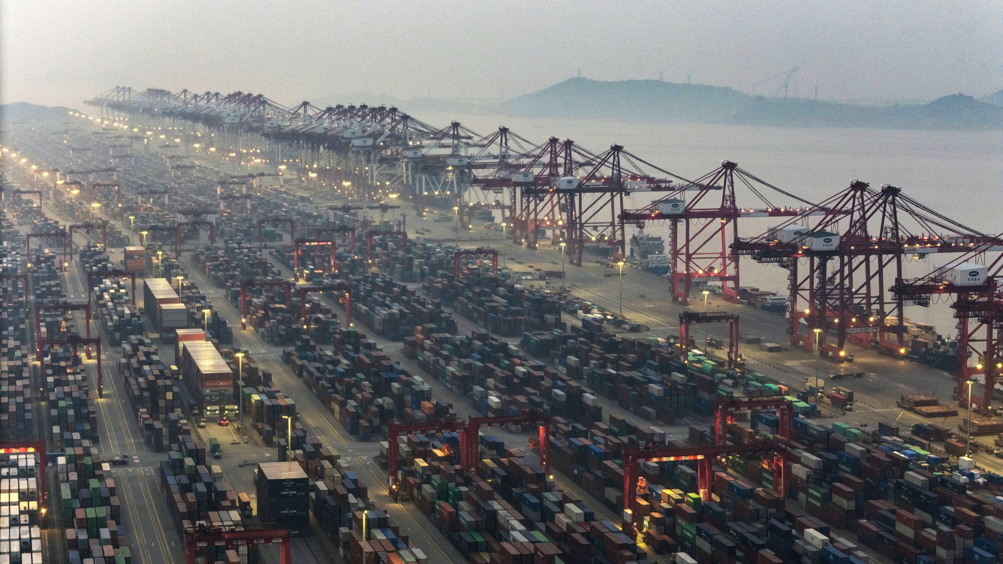 Gantry cranes and shipping containers at the Yangshan Deepwater Port in Shanghai, China.