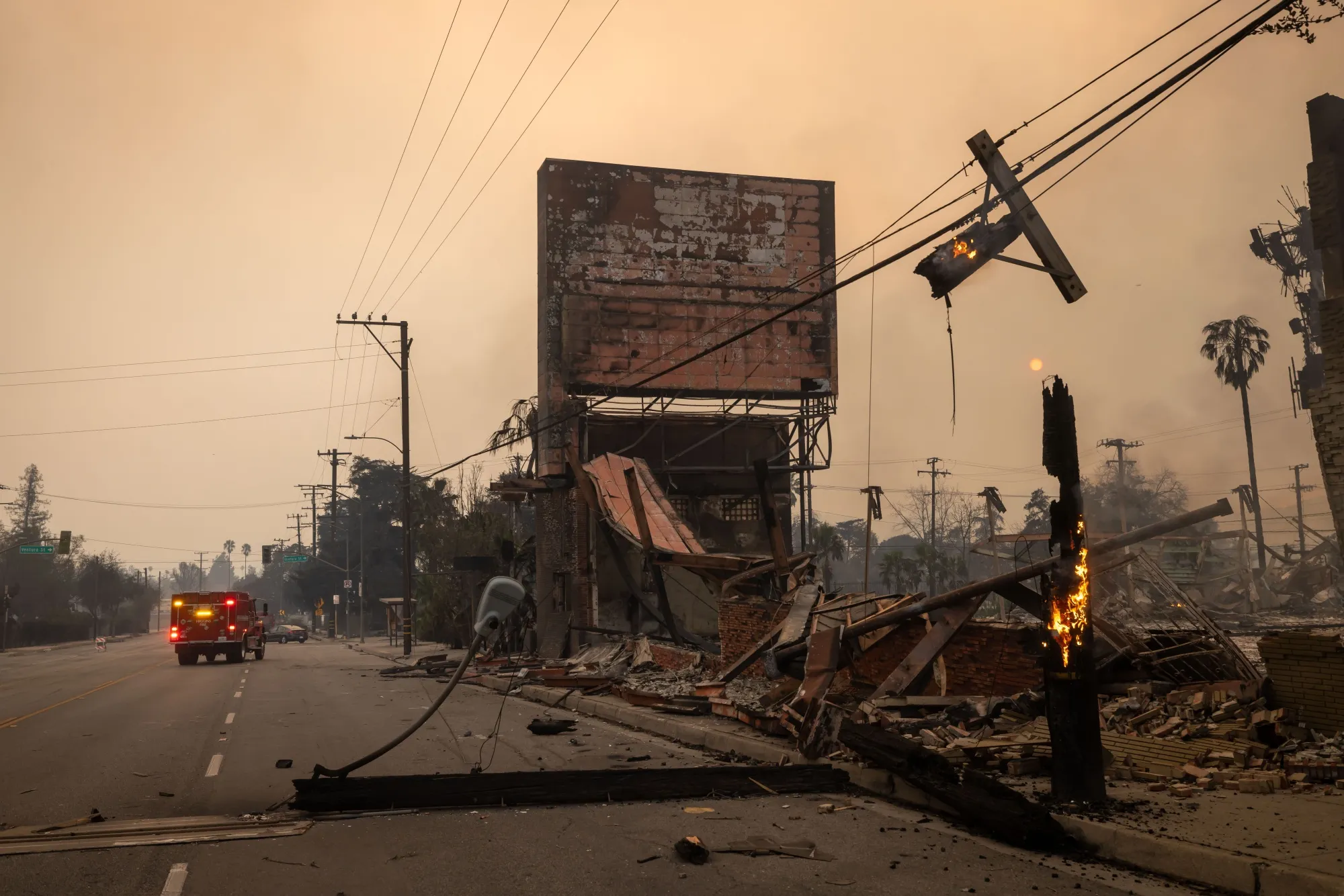The Eaton fire has killed at least four people, destroyed or damaged 4,000 to 5,000 structures and charred nearly 14,000 acres in Altadena and Pasadena.