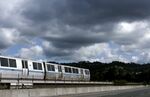 A Bay Area Rapid Transit (BART) train makes its way along the tracks in Oakland, California.