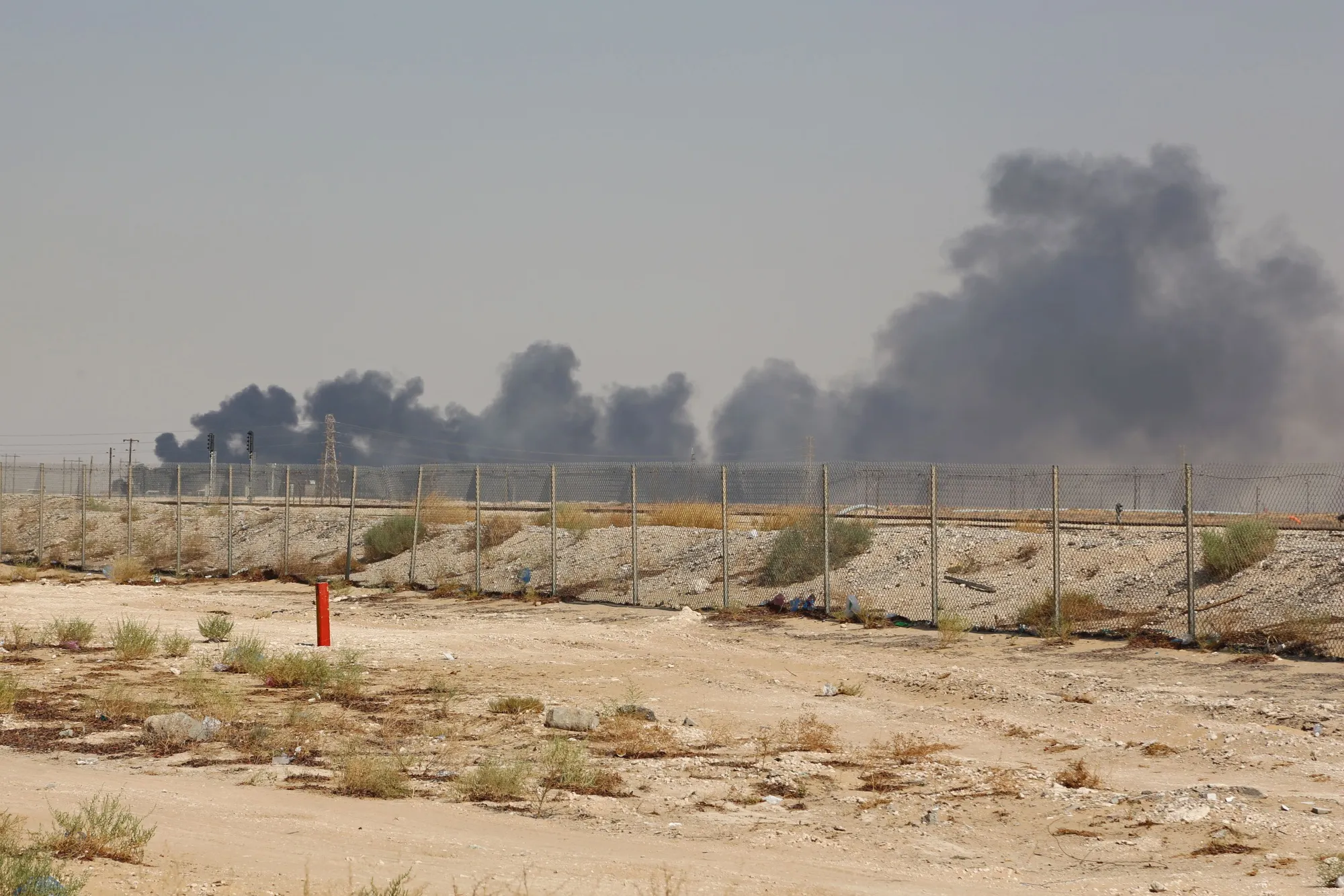Smoke billows from an Aramco oil facility in Abqaiq on Sept. 14.