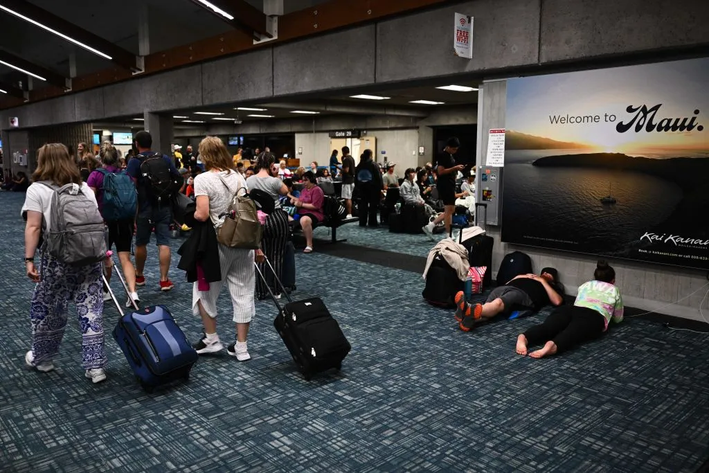 Passengers&nbsp;waiting for delayed and canceled flights off the island in the aftermath of wildfires in western Maui in Kahului, Hawaii.&nbsp;