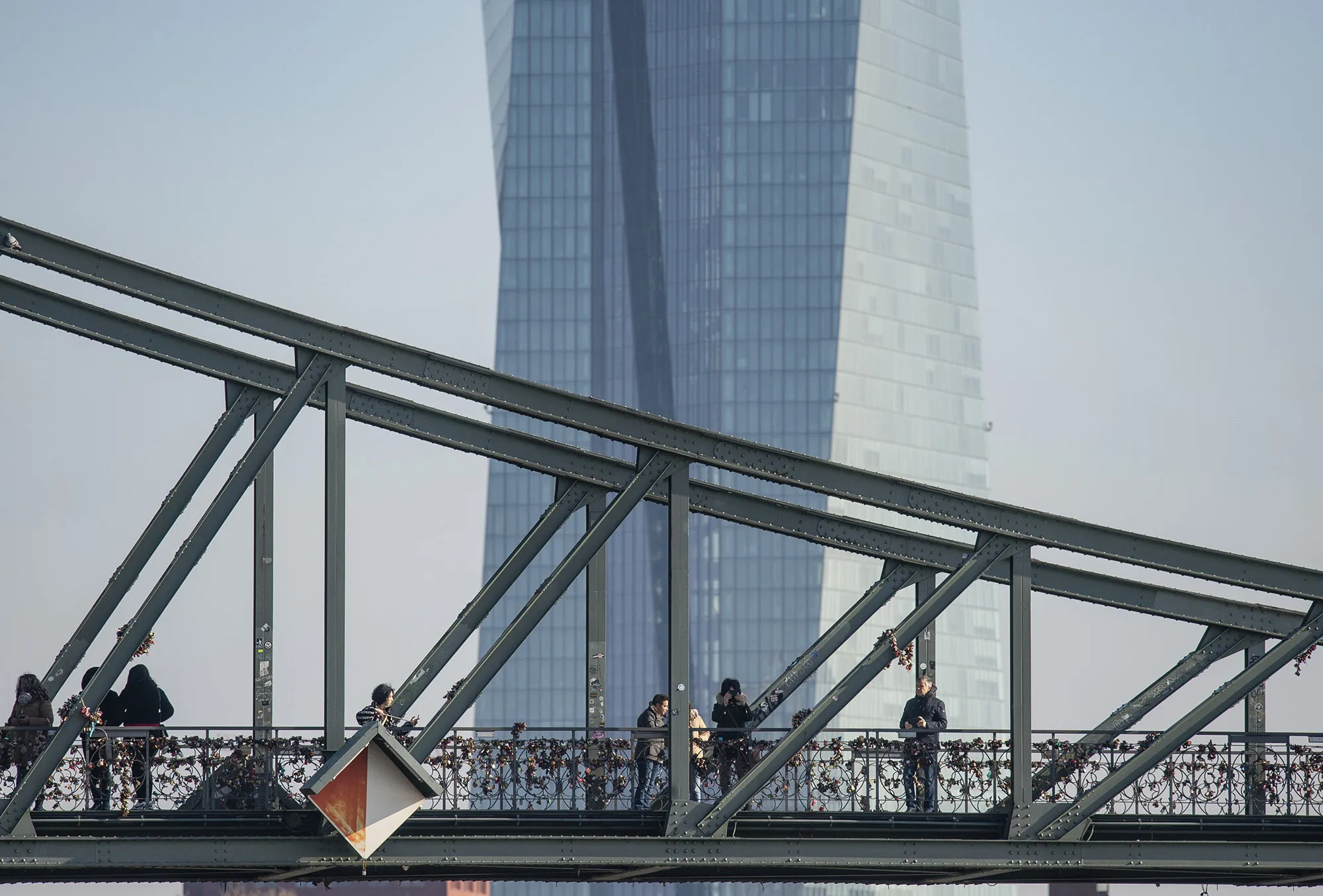 A pedestrian bridge across the Main with the European Central Bank beyond.&nbsp;