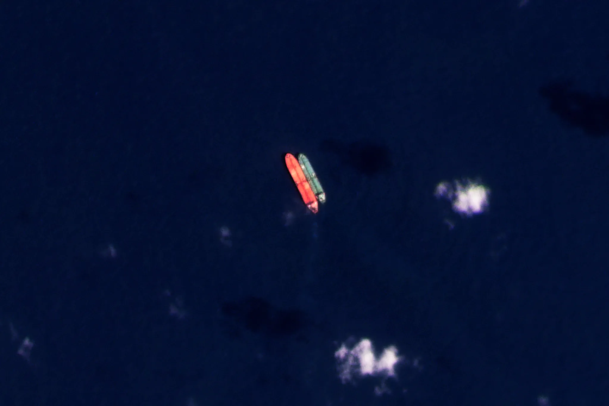 A satellite photo of vessels identified as the Virgo, left, and the Suez Rajan, by the advocacy group United Against Nuclear Iran, seen in the South China Sea on Feb. 13, 2022. 