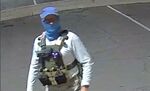 An armed individual dressed in tactical gear at a ballot drop box in Mesa, Arizona, on Oct. 21.