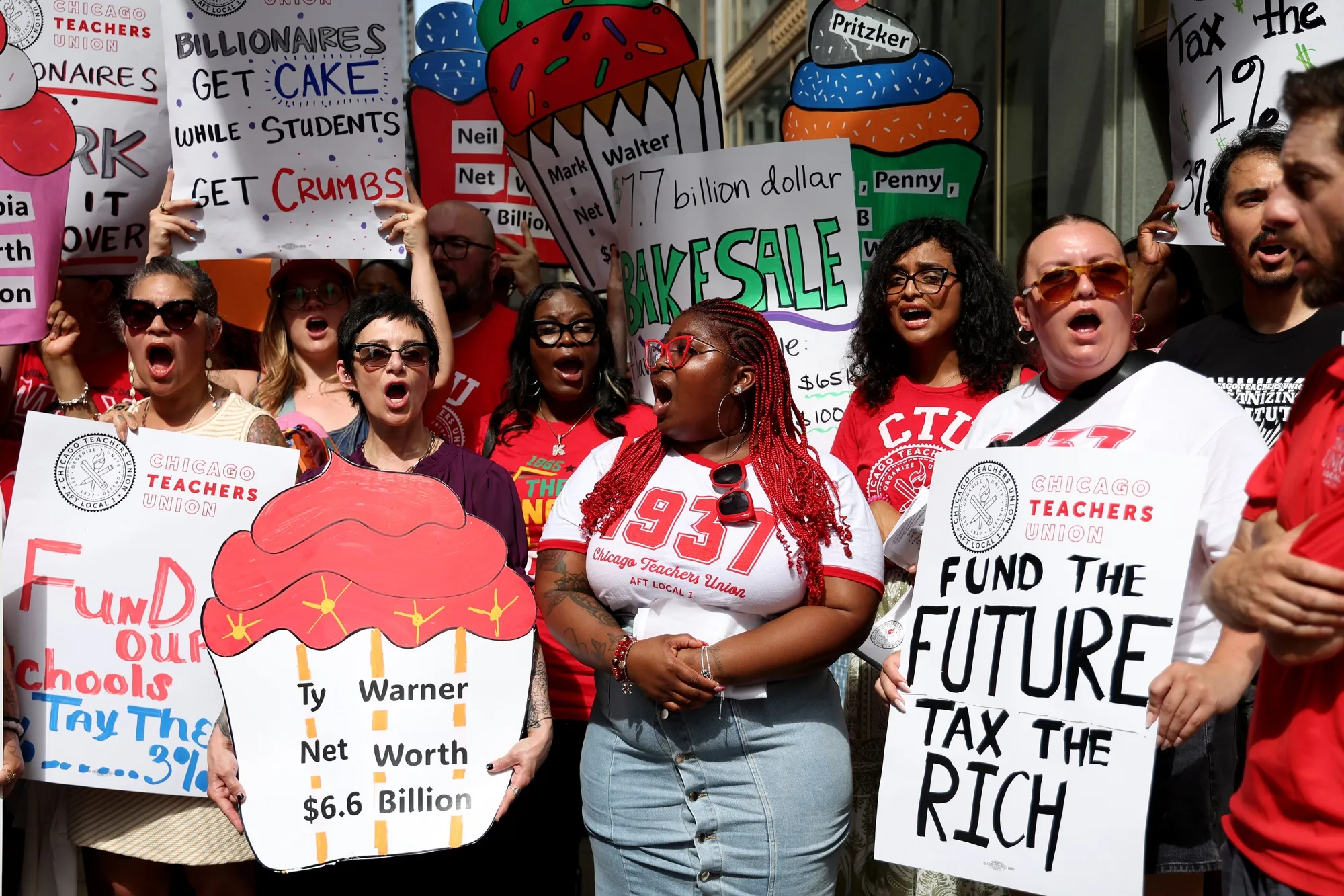 Chicago Teachers Union members and supporters rally outside Chicago Public Schools headquarters before a Chicago Board of Education meeting in July.