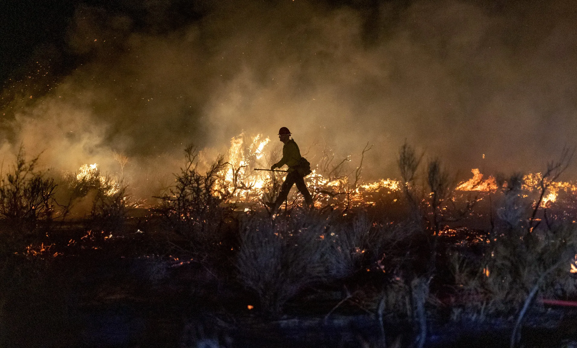 Firefighters work to contain a brush fire along Tehachapi Willow Springs Road in Tehachapi, California, on&nbsp;April 6.&nbsp;