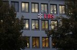 An illuminated logo sits on display outside the UBS Group AG offices in Zurich, Switzerland, on Tuesday, Oct. 22, 2019. UBS’s rich clients added $15.7 billion in new money last quarter, giving a boost to star hire Iqbal Khan as he seeks to reinvigorate the key wealth management unit.