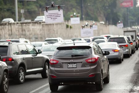 An Uber Technologies Inc. drone advertises uberPOOL above traffic on a highway in Mexico City, Mexico, on Friday, June 17, 2016.