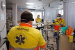 Workers of the Emergency Medical Services of Catalonia attend a patient on April 24.