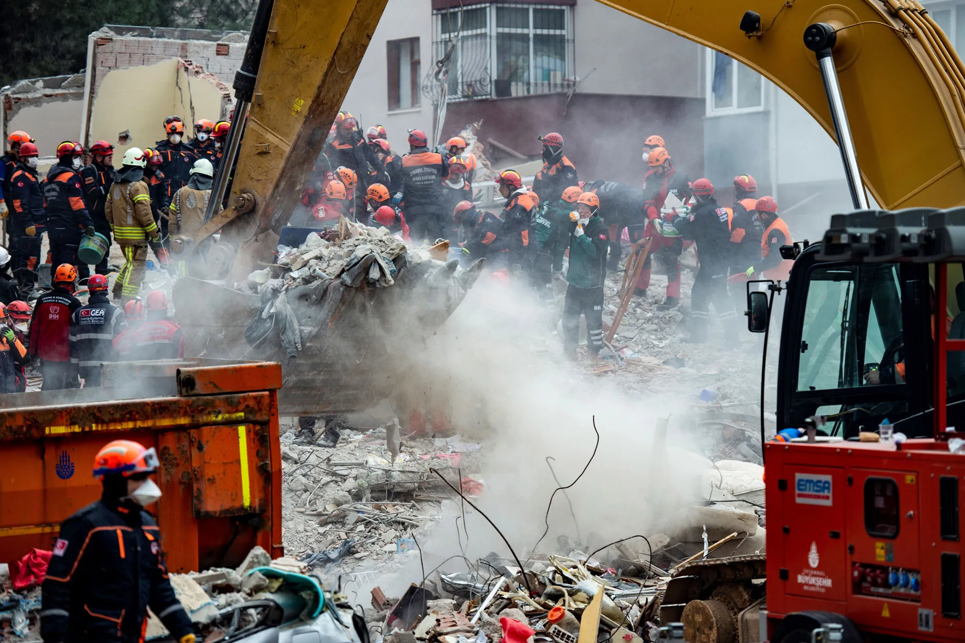 Rescue workers search the rubble of the building in Istanbul.