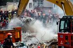 Rescue workers search the rubble of the building in Istanbul.