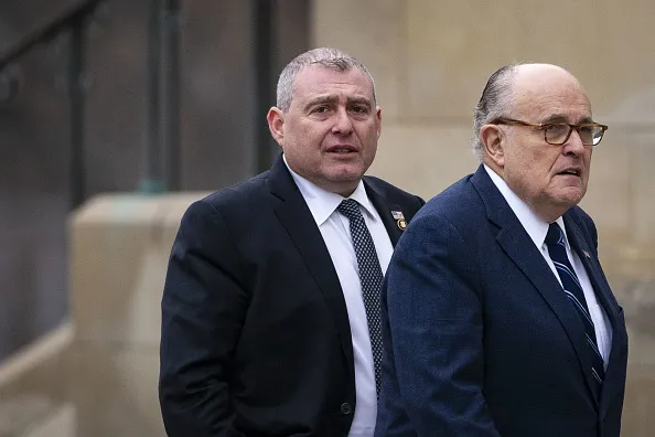 Lev Parnas, left, is accused of a campaign crime.