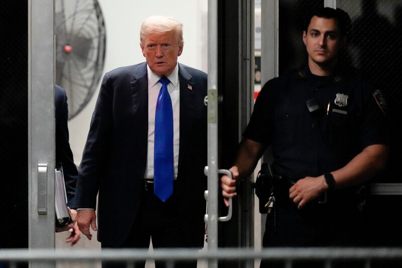 Former US President Donald Trump, left, at Manhattan criminal court in New York, May 30, 2024.