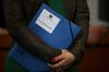 A member of the inquiry committee holds a document folder at the inquiry into the collapse of Wirecard AG at the German Bundestag in Berlin, on March 18.