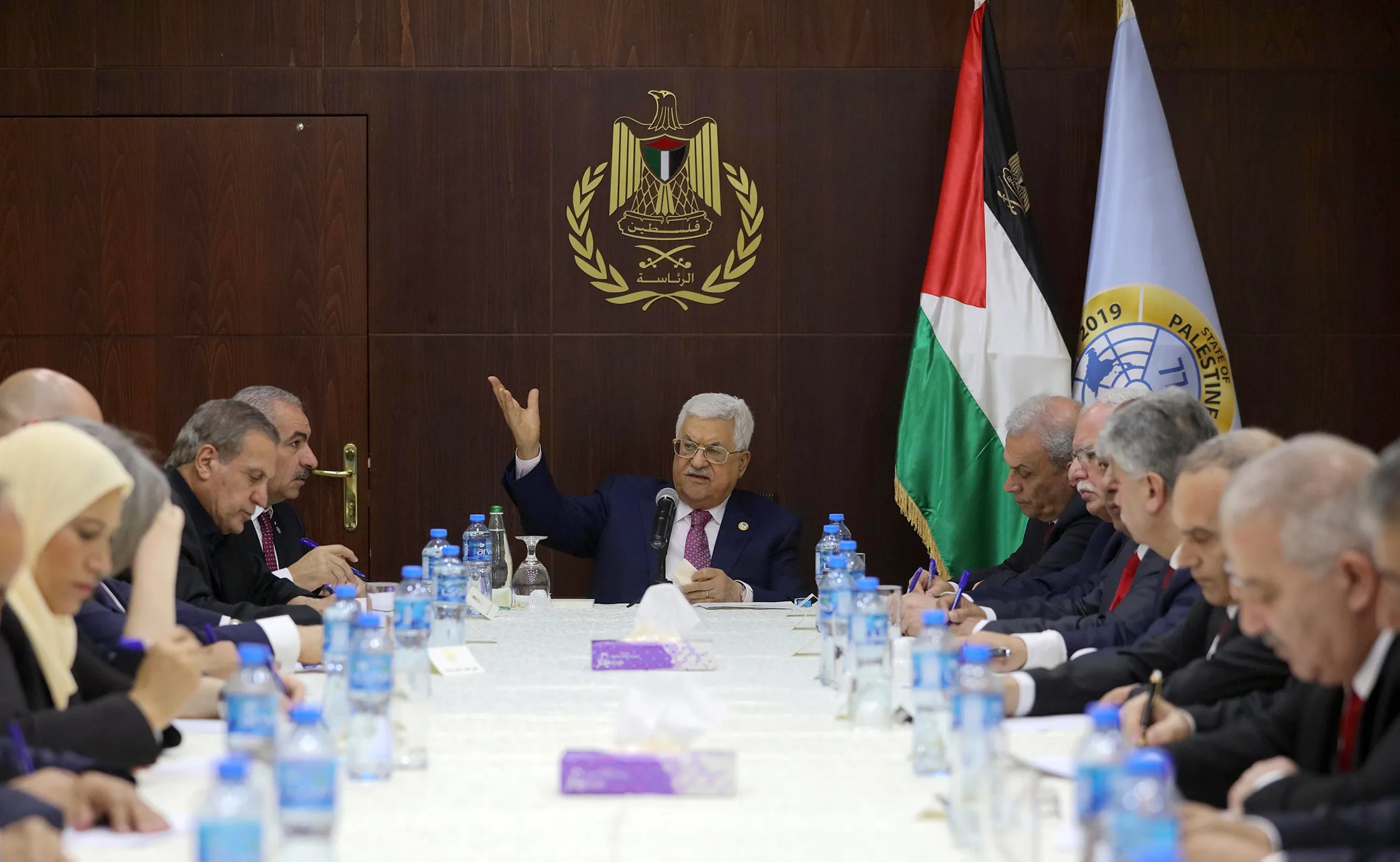 President Mahmud Abbas, center, meets with the newly announced government.