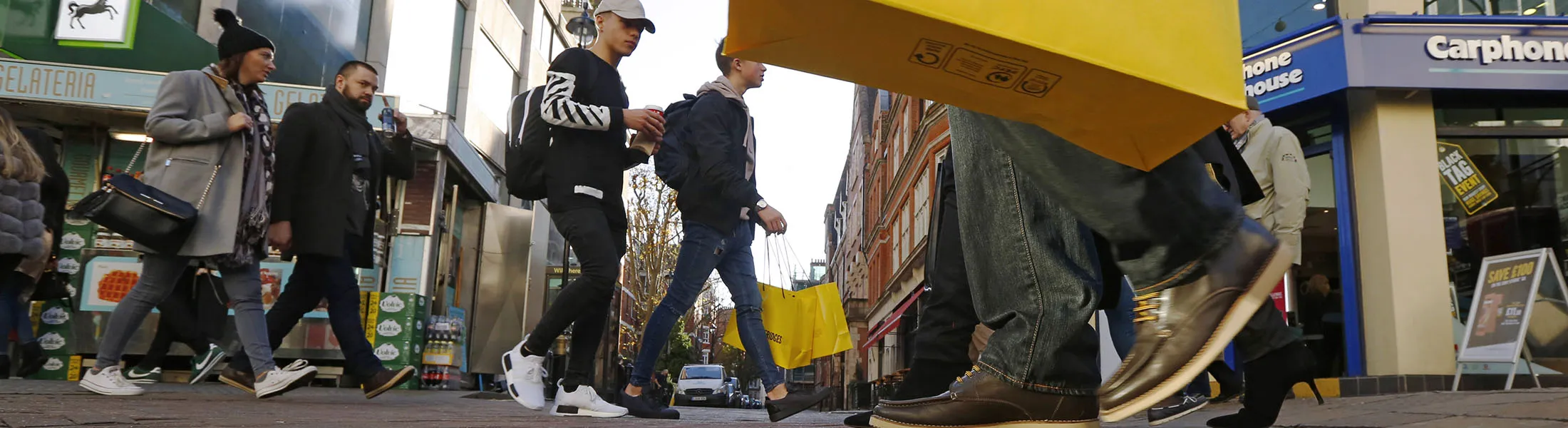 A crowd of pedestrians and shoppers walk on Oxford Street, in London, U.K., on Friday, Nov. 25, 2016. Black Friday first became a part of U.K. shopping culture in 2014 when a rush for bargains saw fights break out as crowds gathered outside stores, in 2016 however, only 21 percent of British consumers interviewed by consultant Retail Economics said they plan to shop for Black Friday bargains.