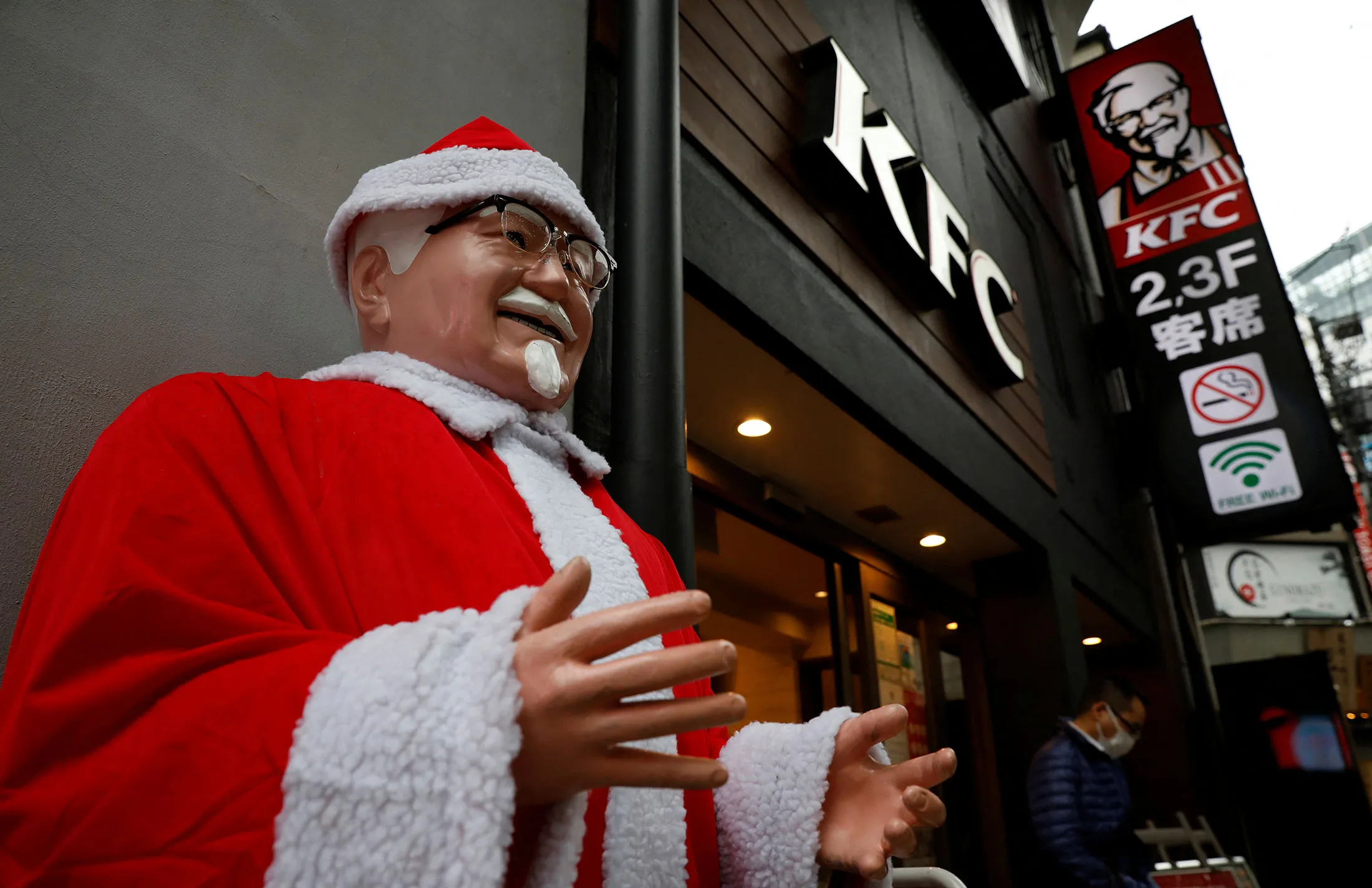 A Colonel Sanders statue dressed as Santa Claus at a Tokyo KFC outlet.