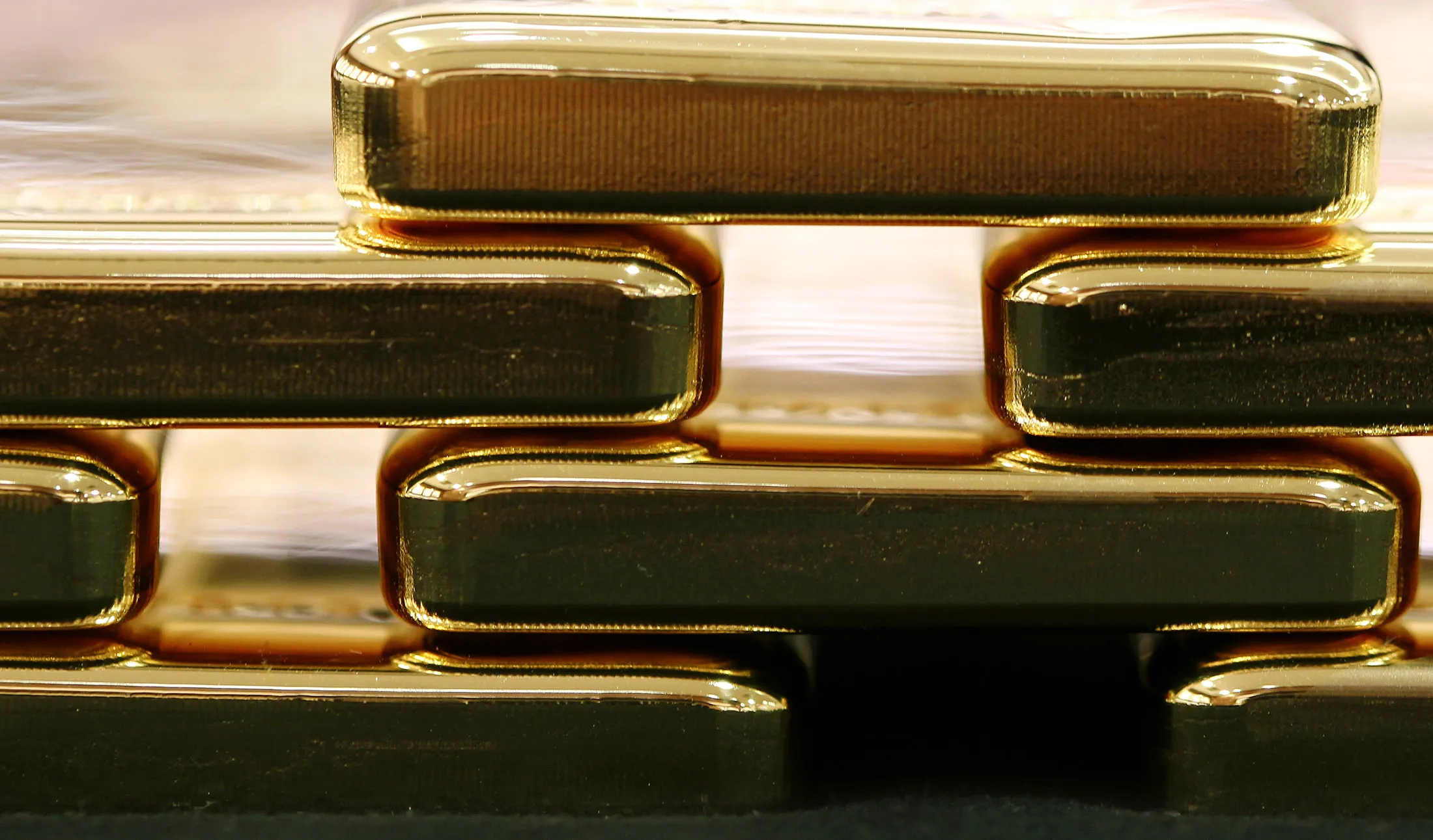 One-kilogram gold bars are arranged for a photograph at a Tanaka Kikinzoku Kogyo K.K. store in Tokyo, Japan, on Wednesday, July 10, 2013. Gold headed for the best weekly performance since October 2011 after Federal Reserve Chairman Ben S. Bernanke called for maintaining stimulus, while assets in the largest bullion-backed exchange-traded product held steady.
