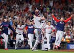 Will Smith #51 and Travis d'Arnaud #16 of the Atlanta Braves celebrate the team's 7-0 win against the Houston Astros in Game Six to win the 2021 World Series at Minute Maid Park in Houston, Texas, on Nov. 2.