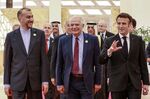 Hossein Amirabdollahian, left, Josep Borrell, center, and French President Emmanuel Macron, fin Jordan, on Dec. 20.&nbsp;