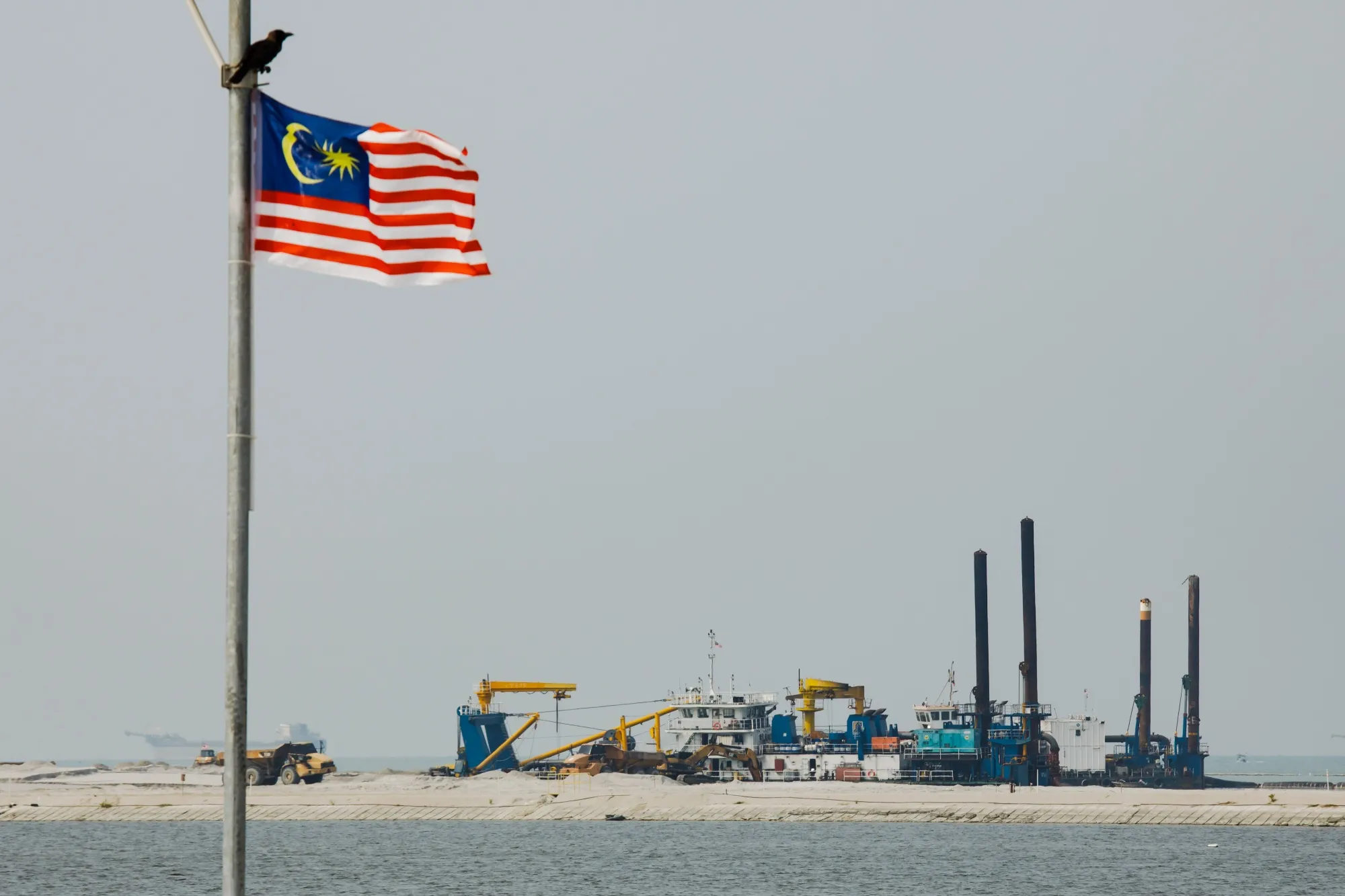 A Malaysian flag near the construction site for Silicon Island reclamation works.