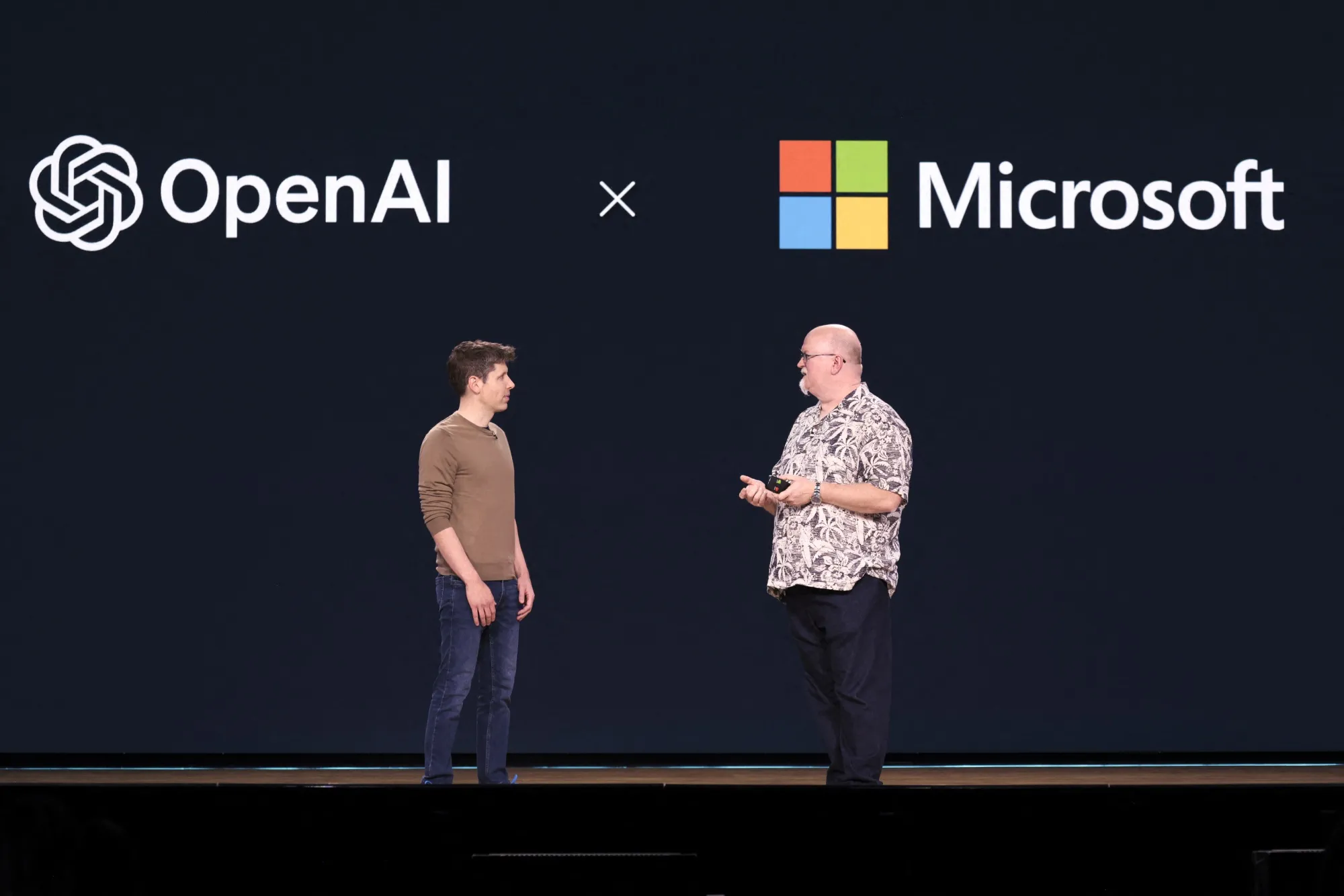 OpenAI CEO Sam Altman, left, speaks with Microsoft Chief Technology Officer Kevin Scott during the Microsoft Build conference&nbsp;in Seattle in 2024.&nbsp;