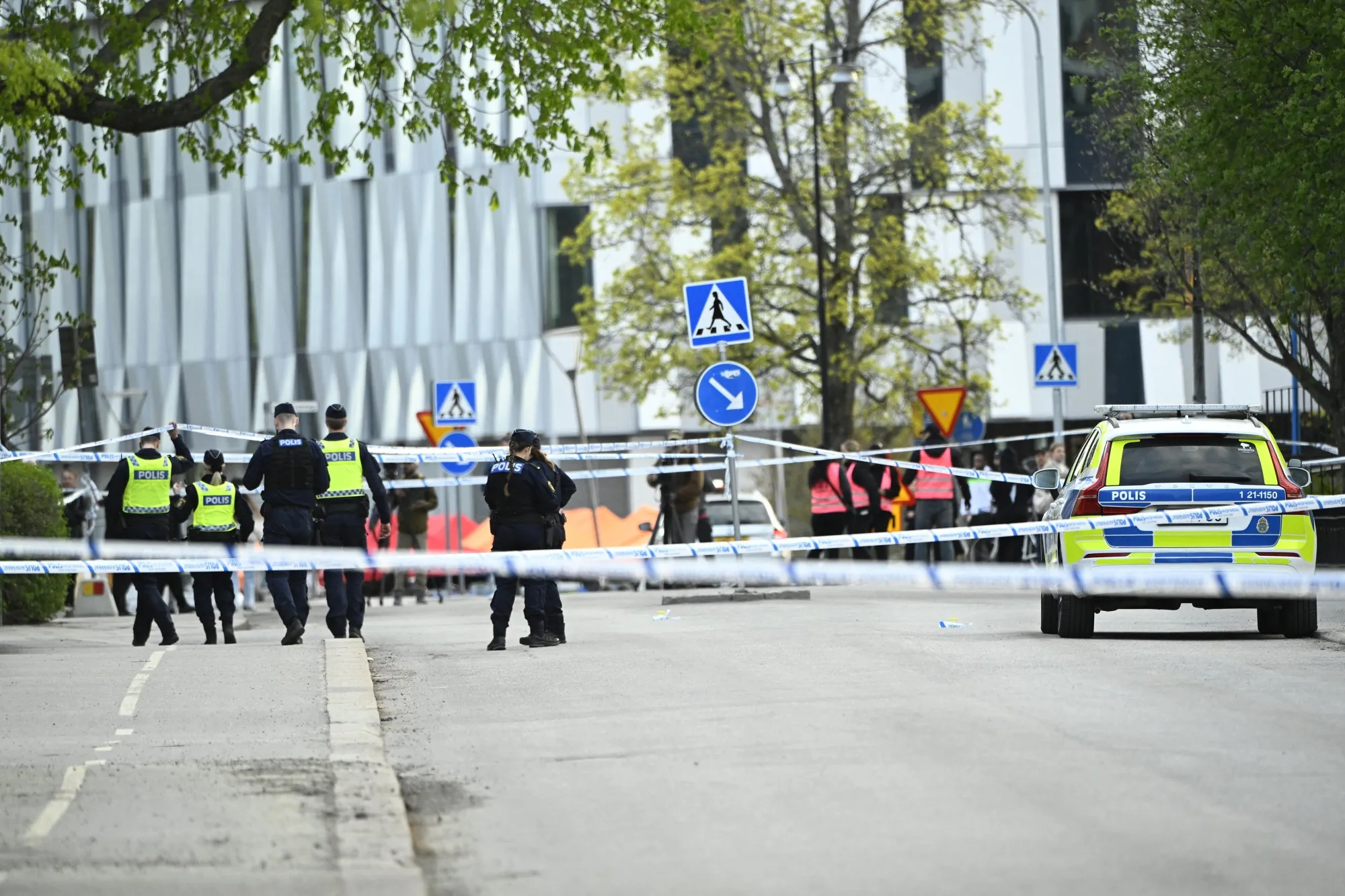 Police officers cordon off the scene following&nbsp;a shooting in Uppsala, Sweden, in April.