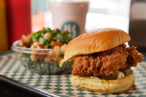 Fried chicken thighs in a Martin's potato roll with pickled jalapeños, hot honey, and a little mayonnaise.