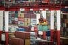 A gantry crane operates as shipping containers sit stacked at the Yangshan Deepwater Port, operated by Shanghai International Port Group Co. (SIPG), in Shanghai, China, on Friday, May 10, 2019. The U.S. hiked tariffs on more than $200 billion in goods from China on Friday in the most dramatic step yet of President Donald Trump's push to extract trade concessions, deepening a conflict that has roiled financial markets and cast a shadow over the global economy.