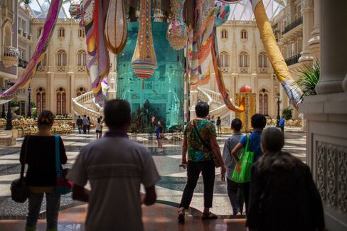 People walk past the Valkyrie Octopus art installation at the MGM Macau casino resort