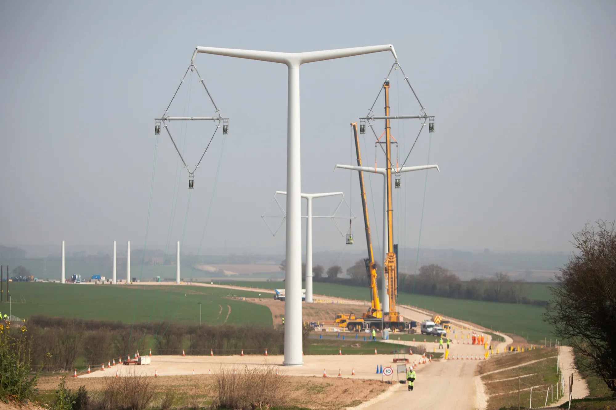 National Grid’s T-Pylon is a lower structure, with less physical bulk. It will be used over the Somerset levels to connect the Hinkley Point C nuclear station.