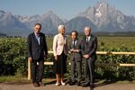 Jerome Powell, chairman of the US Federal Reserve, from right, Kazuo Ueda, governor of the Bank of Japan (BOJ), Christine Lagarde, president of the European Central Bank (ECB), and Andrew Bailey, governor of the Bank of England (BOE), walk the grounds during the Kansas City Federal Reserve's Jackson Hole Economic Policy Symposium in Moran, Wyoming, US, on Friday, Aug. 22, 2025. Powell carefully opened the door to an interest-rate cut in September, pointing to rising risks for the labor market even as worries over inflation remain.