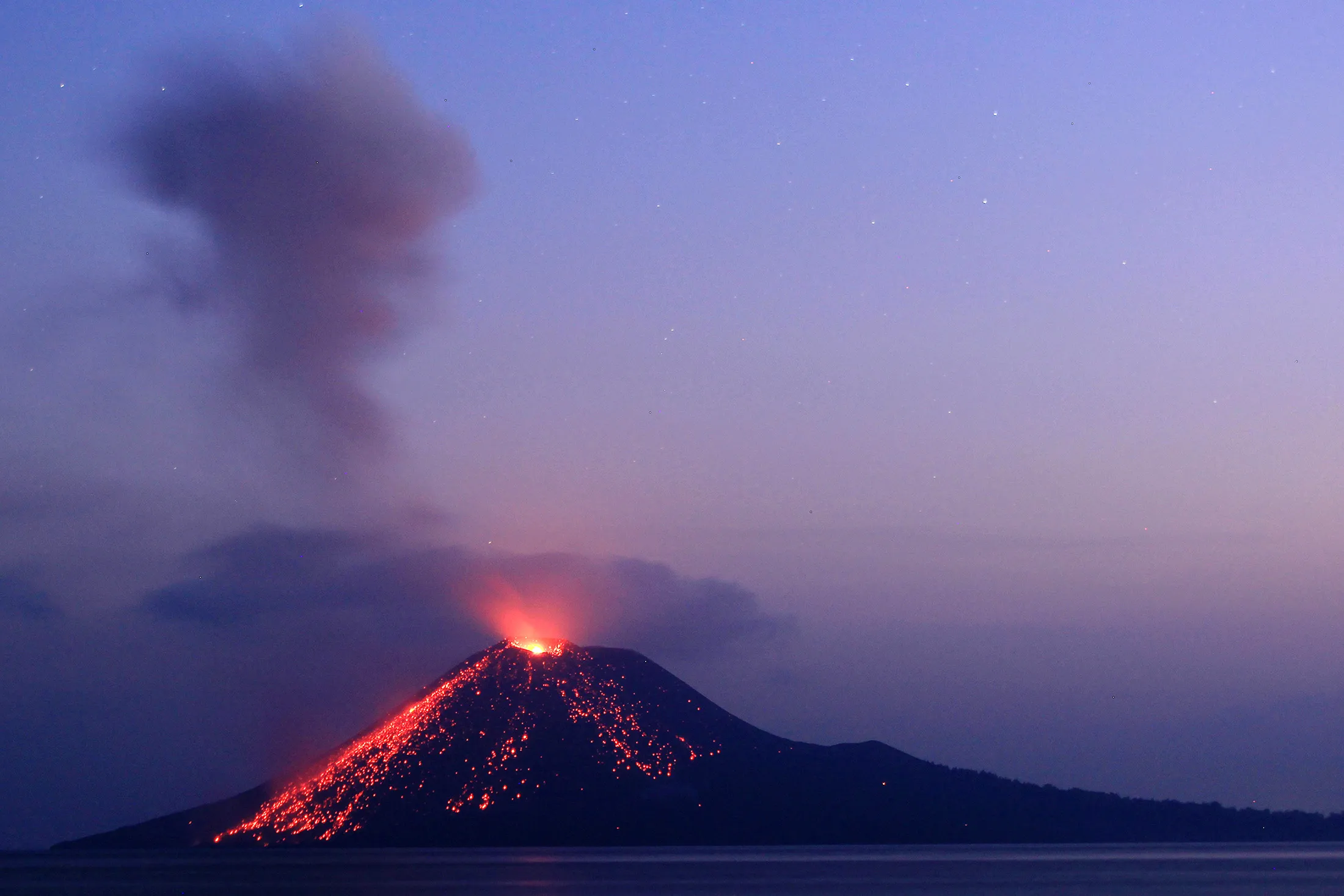 Lava streaming down from Mount Anak Krakatau during an eruption on July 19.