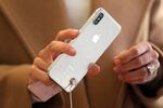 A customer tests an iPhone X smartphone at the Apple Inc. store on Regent Street in London, U.K.