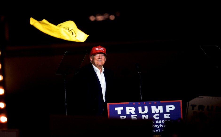Donald Trump throws a Pittsburgh Steelers Terrible Towel while holding a rally at Atlantic Aviation in Moon, Pennsylvania, November 6, 2016. 