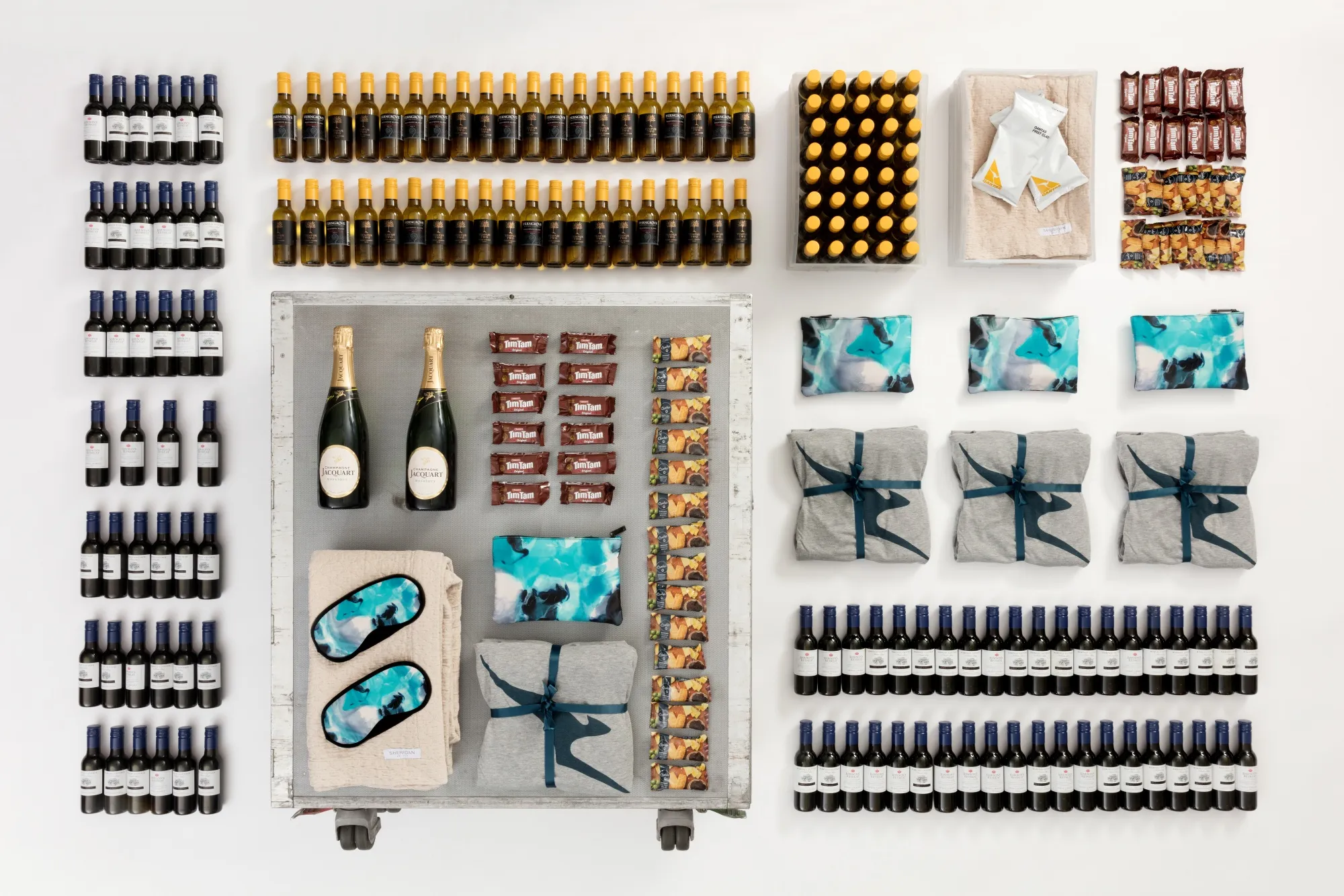 The 747 half bar cart complete with drinks and an amenity kit.