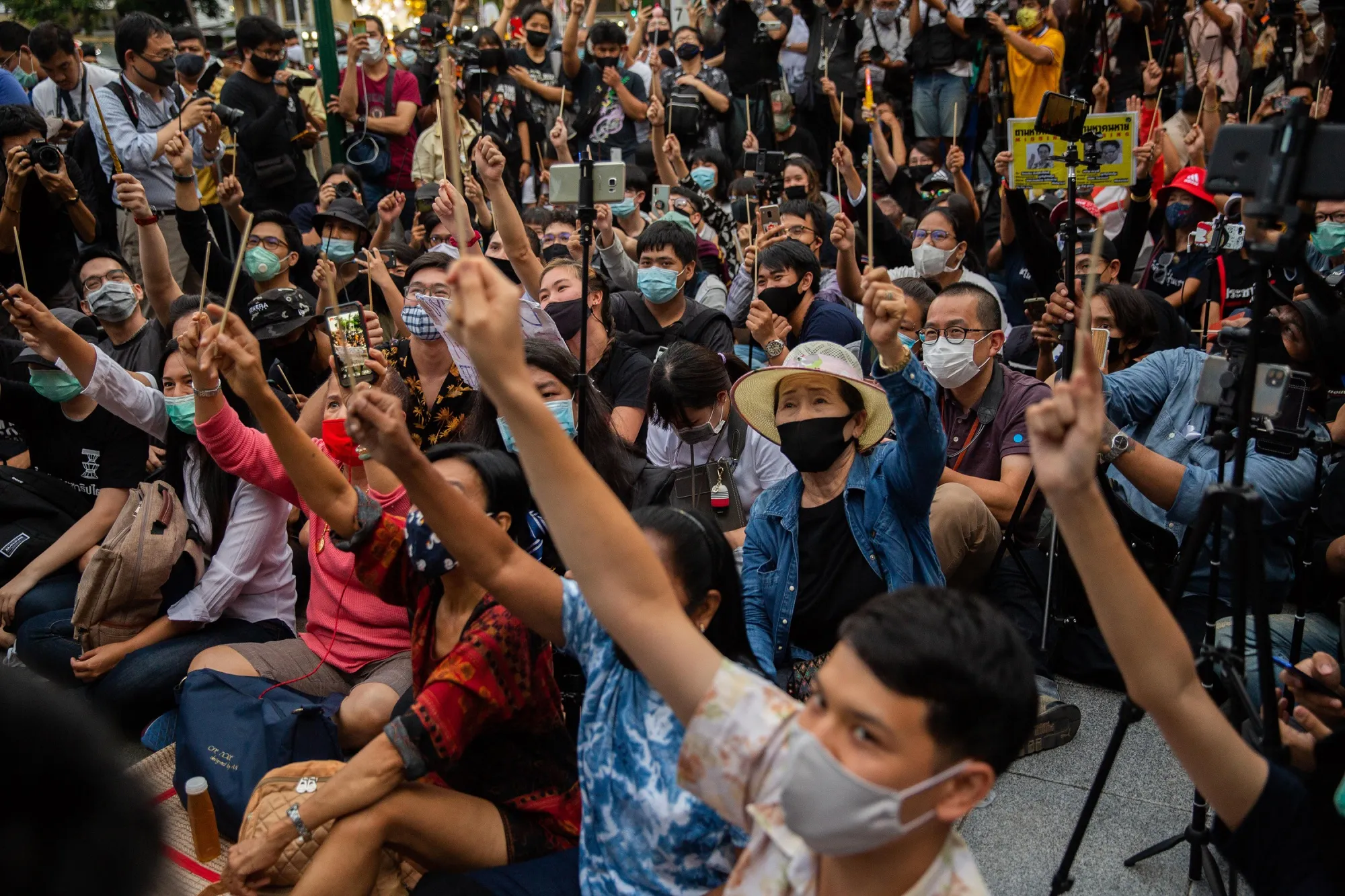 Anti-government protesters wave chopsticks during a rally in front of Democracy Monument in Bangkok, on Aug. 3.