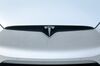 A Tesla Inc. badge is displayed on a Model X electric vehicle in San Ramon, California.
