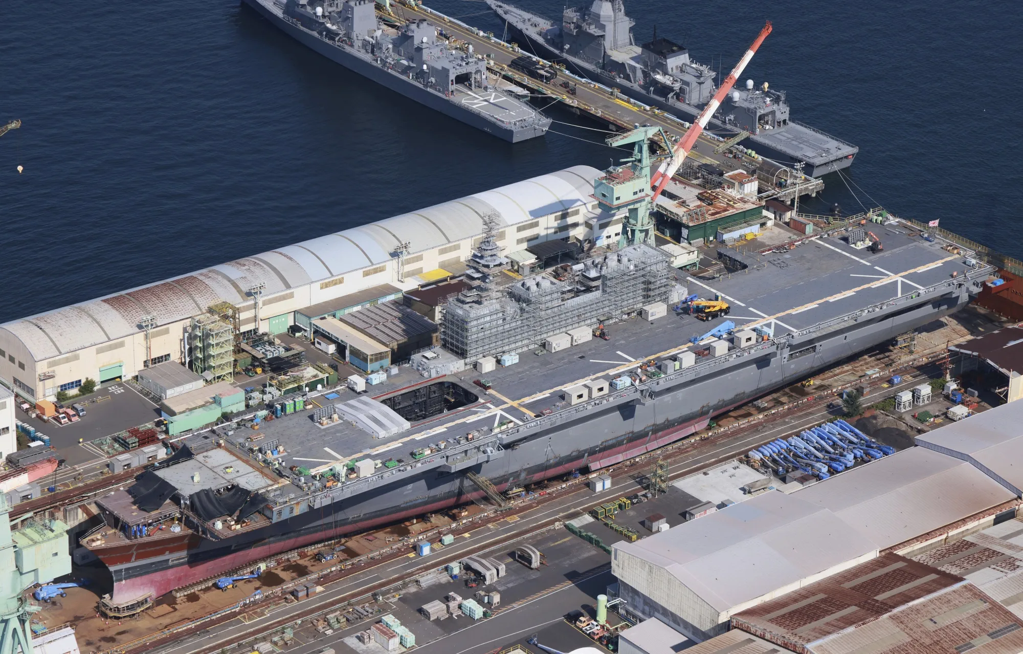 The Japan Maritime Self-Defense Force (JMSDF) helicopter-carrying destroyer Izumo with its bow cut off for conversion into an aircraft carrier in Yokohama City.