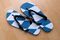High Angle View Of Flip-Flops On Hardwood Floor