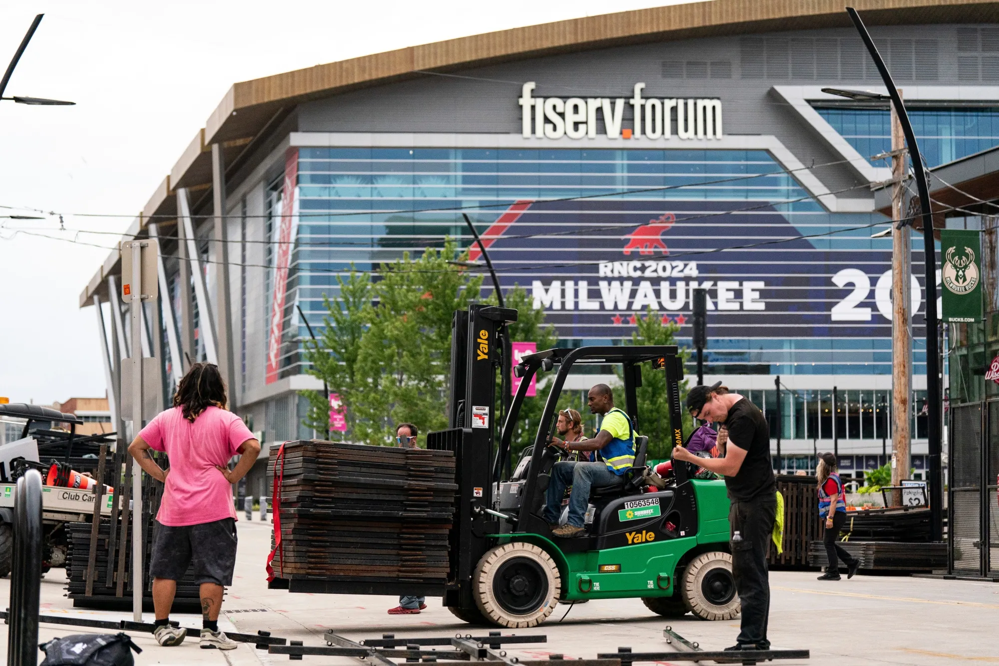 Workers install security fencing near the Fiserv Forum ahead of the Republican National Convention in Milwaukee. 