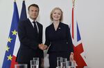Emmanuel Macron and Liz Truss.