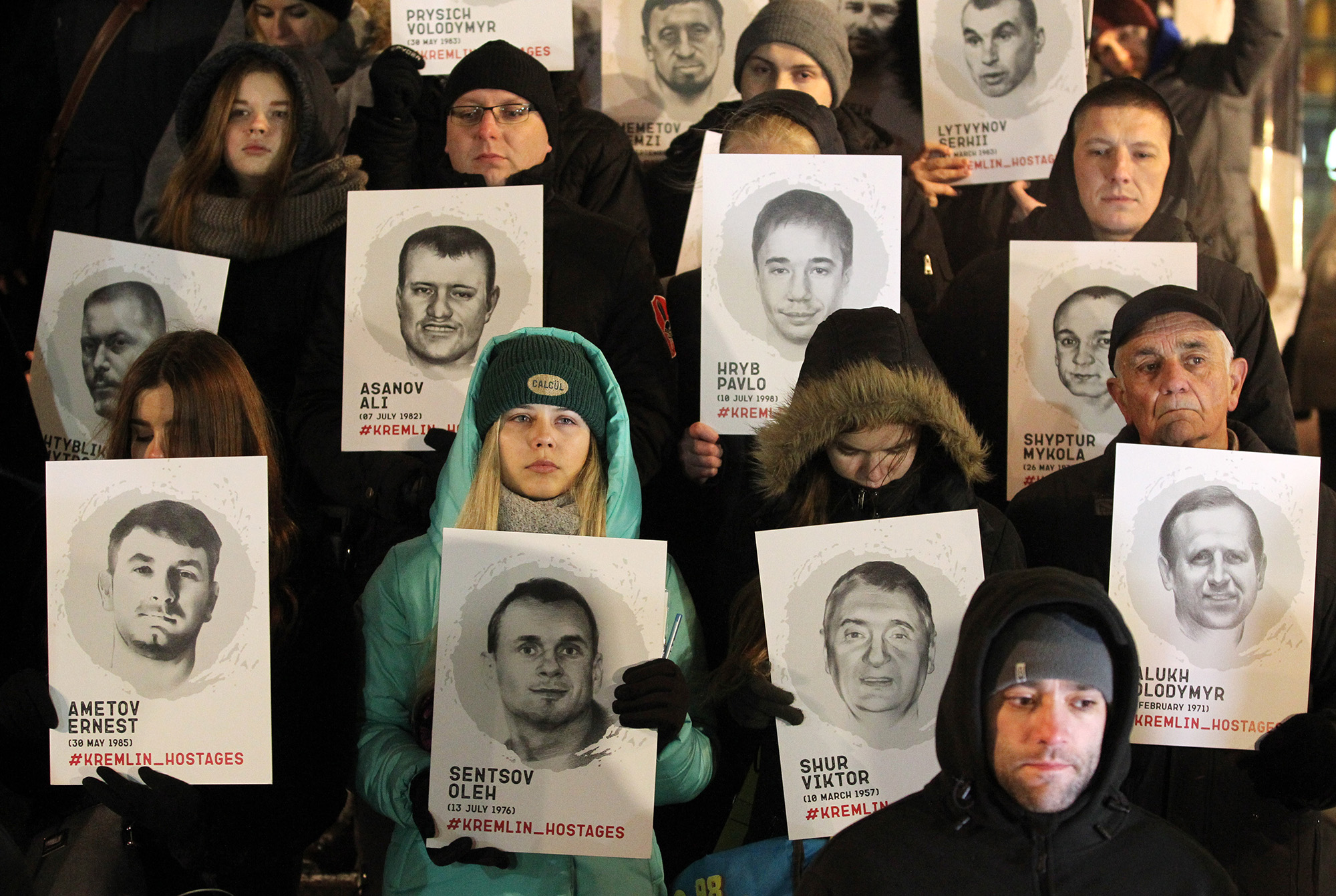 Ukrainians hold placards&nbsp;during a rally in support of the Ukrainian navy sailors who were seized by Russia.