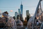 Social distancing bubble dining tents on the roof deck of a restaurant in New York, U.S., on Tuesday, Nov. 10, 2020.