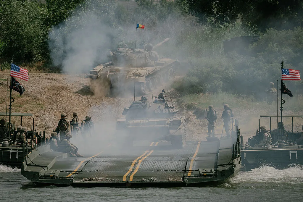 Soldiers from Italy, Romania, and the United States participate in military exercises on the Danube River, in Romania.