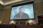 A video of Alex Jones is played on a screen during a select committee hearing&nbsp;in Washington, on July 12.&nbsp;