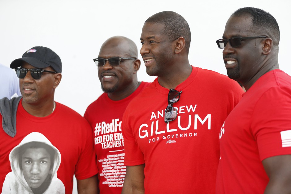 Democratic gubernatorial candidate Andrew Gillum talks with supporters before he speaks at a rally Sunday, Aug. 19, 2018, in Miami Gardens, Fla.